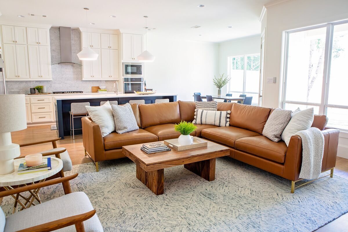 View of living room area with brown leather section