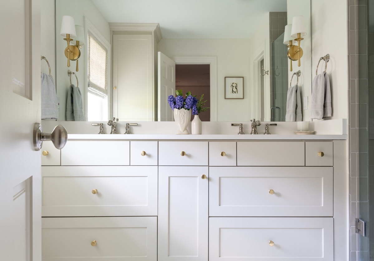 View of dual sink counter top from bathroom entryway